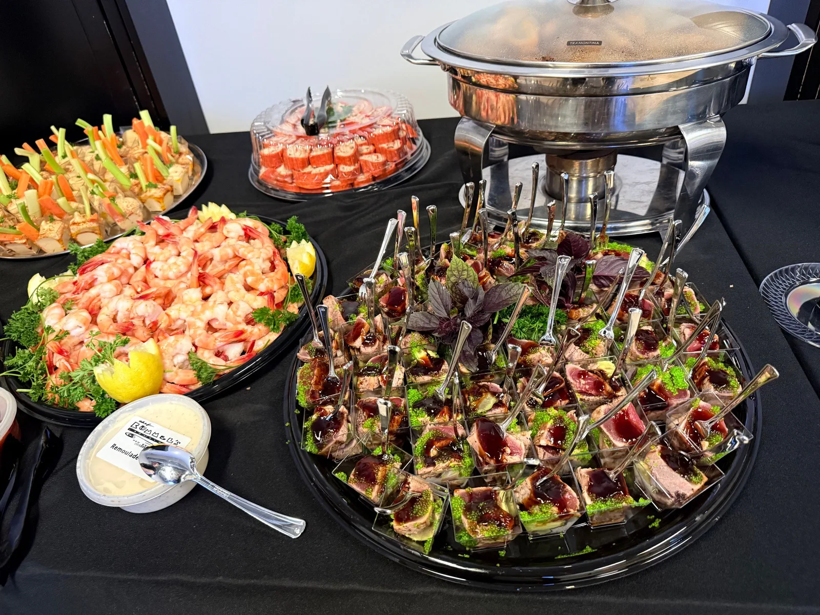 Evening corporate event with shrimp cocktail and tuna bites