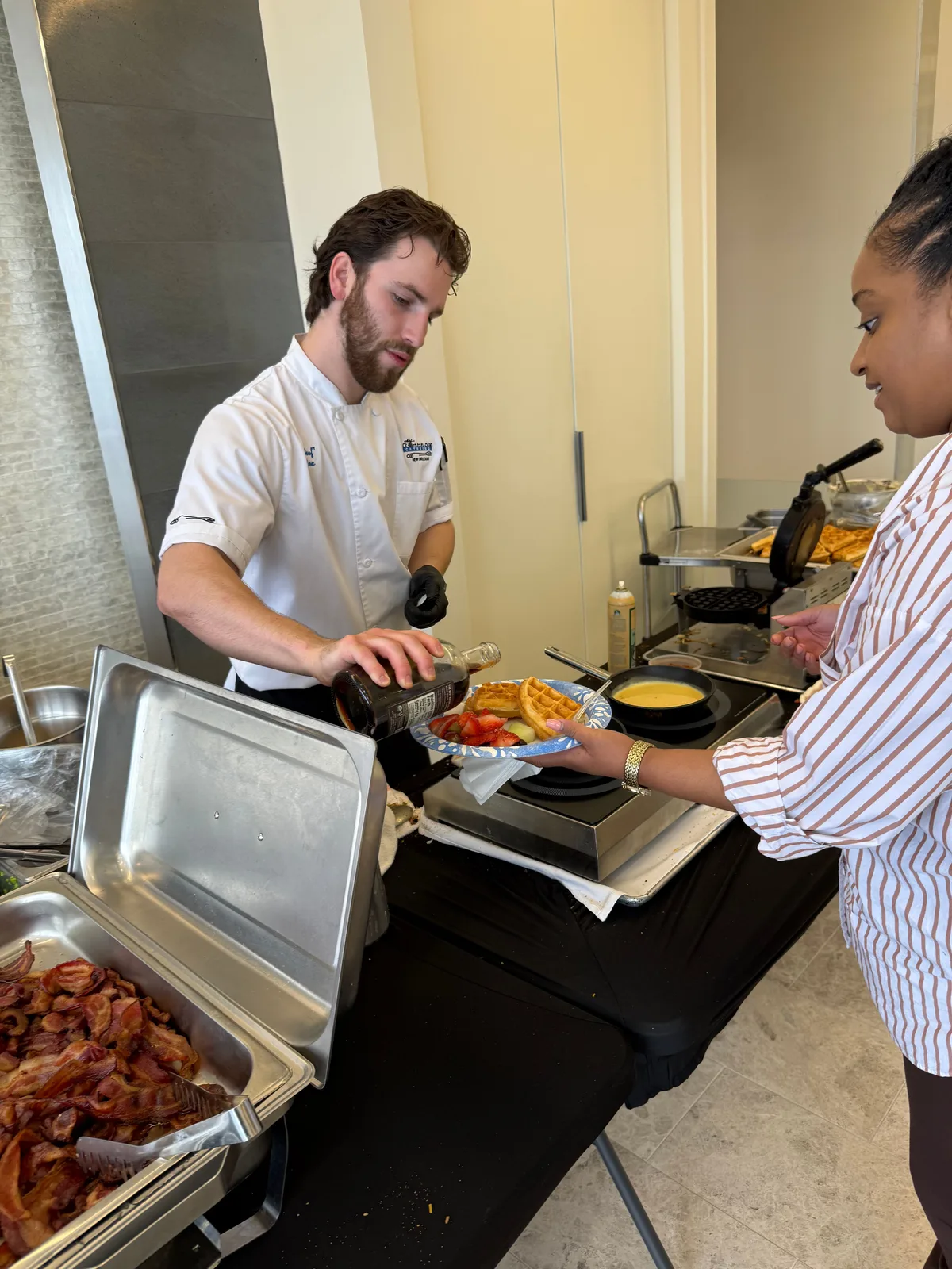 Rex Hernandez preparing dishes in the kitchen